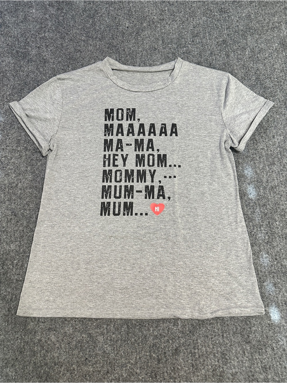 This heather grey graphic tee features a humorous stacked text design